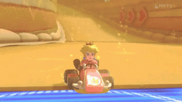 A GiF of Princess Peach in Mario Kart