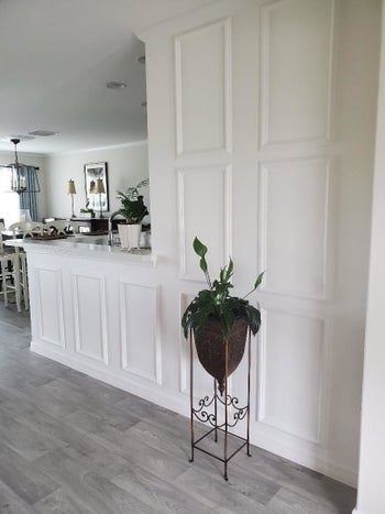 white rectangular panels attached along a wall