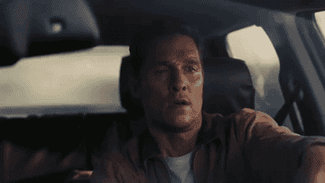 Cooper driving his car and tearing up in Interstellar
