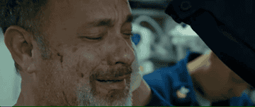 Captain Phillips crying as a doctor checks him out in Captain Phillips