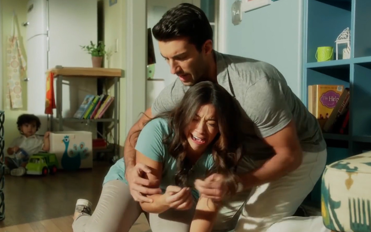Jane falling to the floor crying and being cradled by Justin Baldoni as Rafael in Jane the Virgin