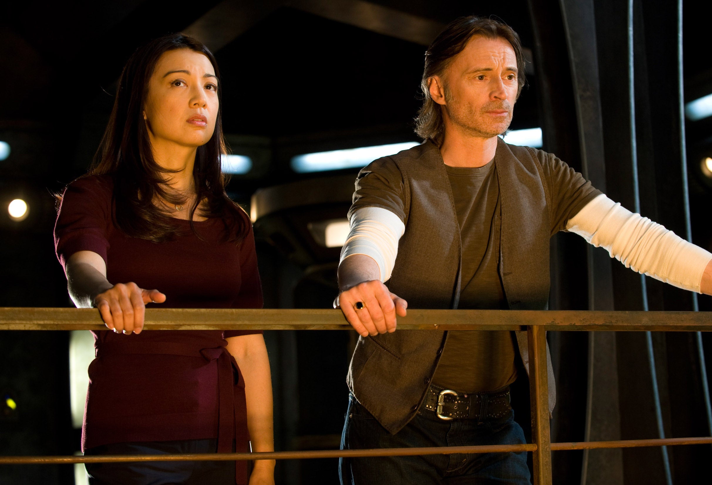 Camile Wray and another character looking out from a balcony