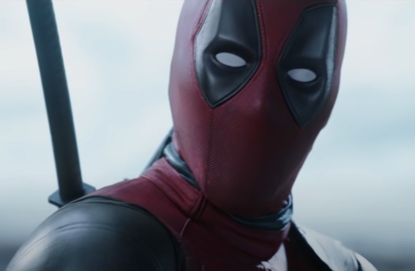 Deadpool looking into the camera breaking the fourth wall to speak to the audience