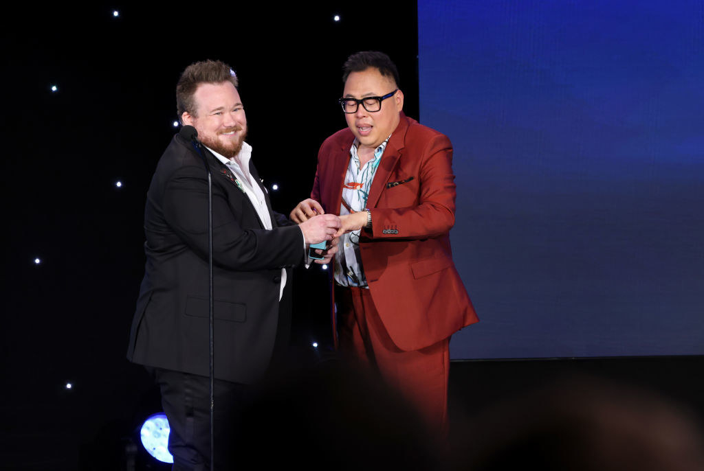 Zeke Smith putting a ring on Nico Santos&#x27; finger at the GLAAD Awards