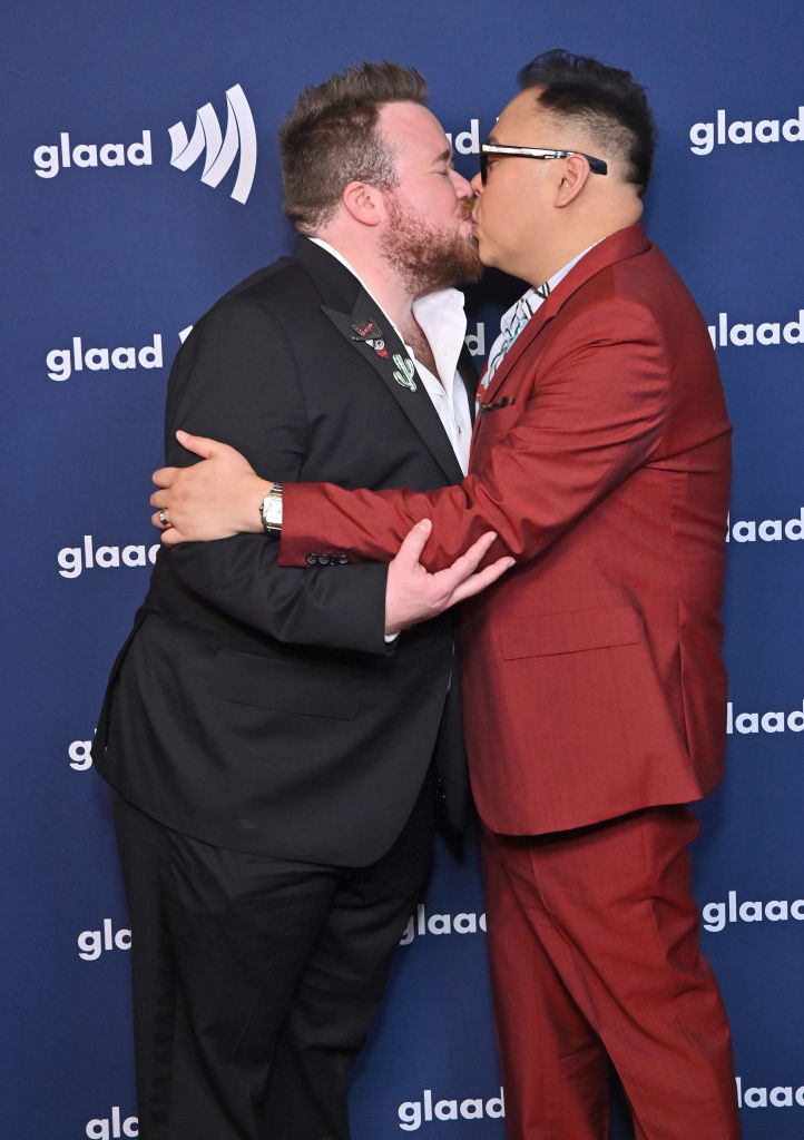 Zeke Smith and Nico Santos kissing at the GLAAD Awards