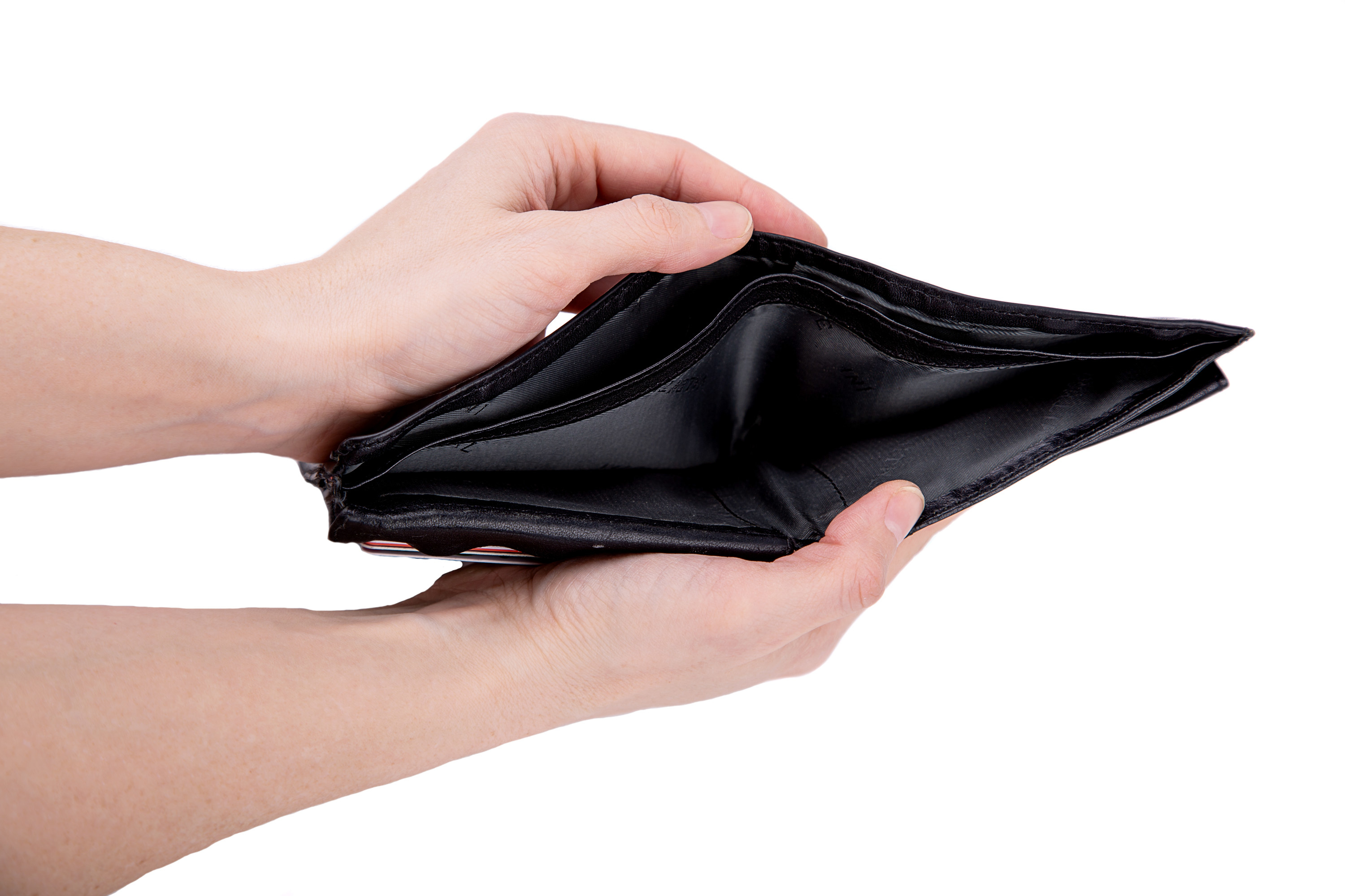 A man holds an empty open wallet in his hands on a white background close-up