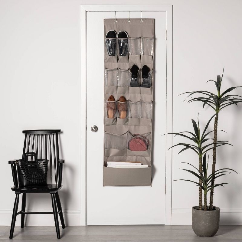 taupe colored over the door hanging shoe organizer with shoes inside