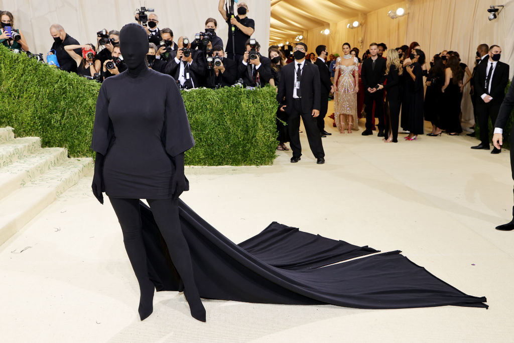 Kim is completely covered in fabric, face included
