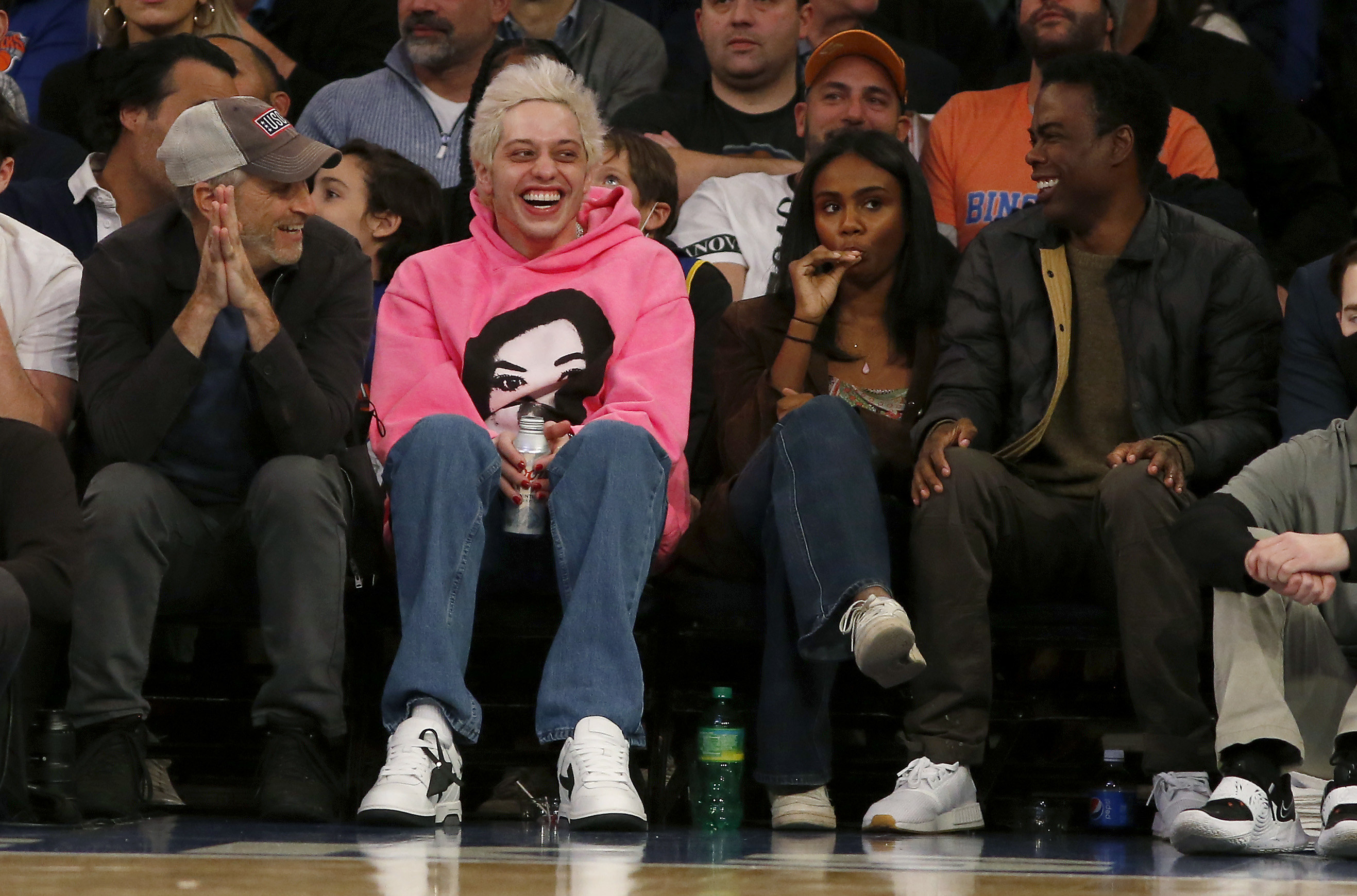 Pete at a basketball game with Chris Rock and Jon Stewart