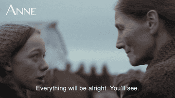 A young girl telling a middle-aged woman that everything will be alright.