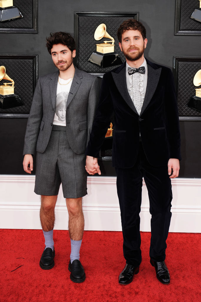 Noah in short pants and Ben in a bow tie and holding hands