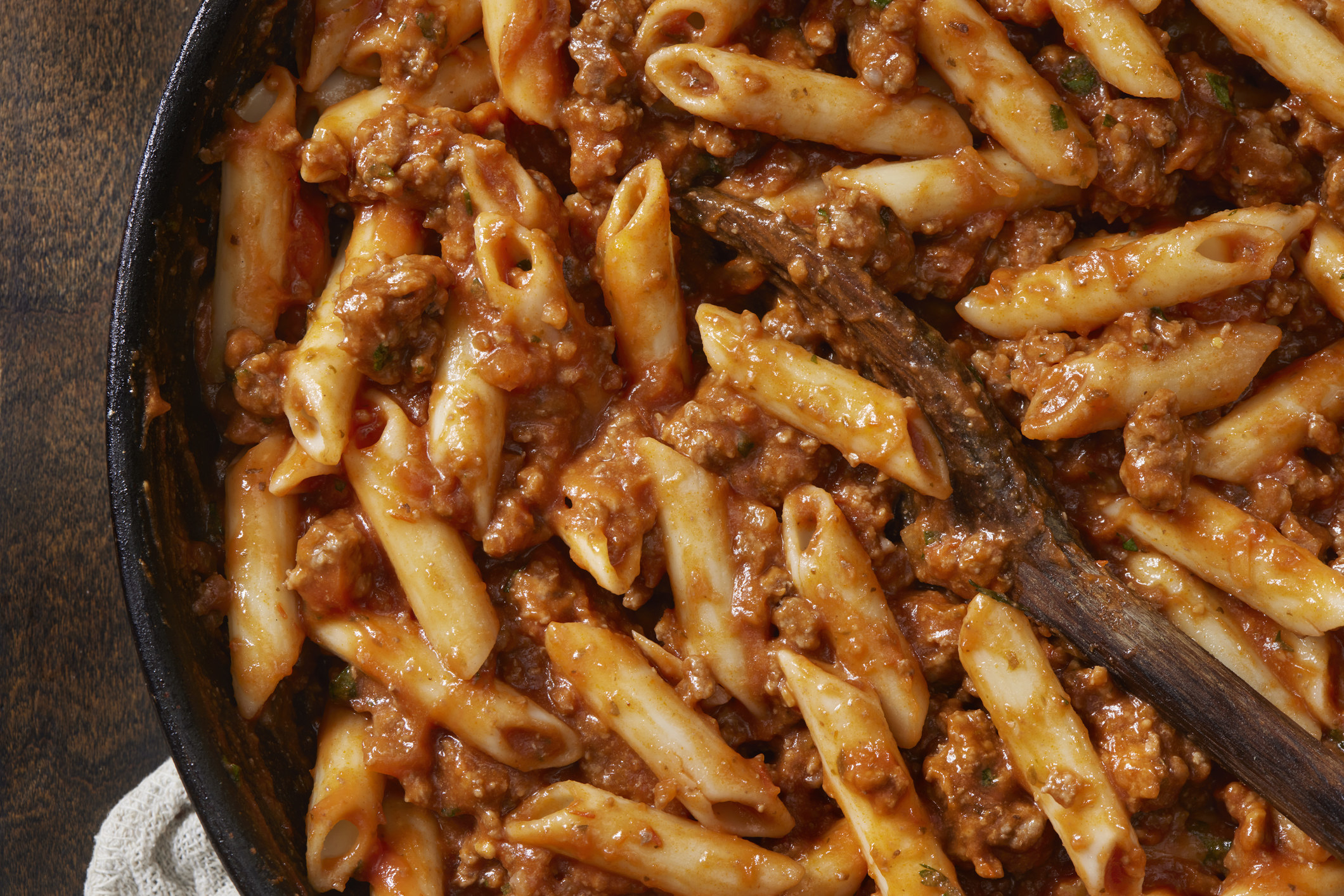 Penne Bolognese in a cast iron skillet.