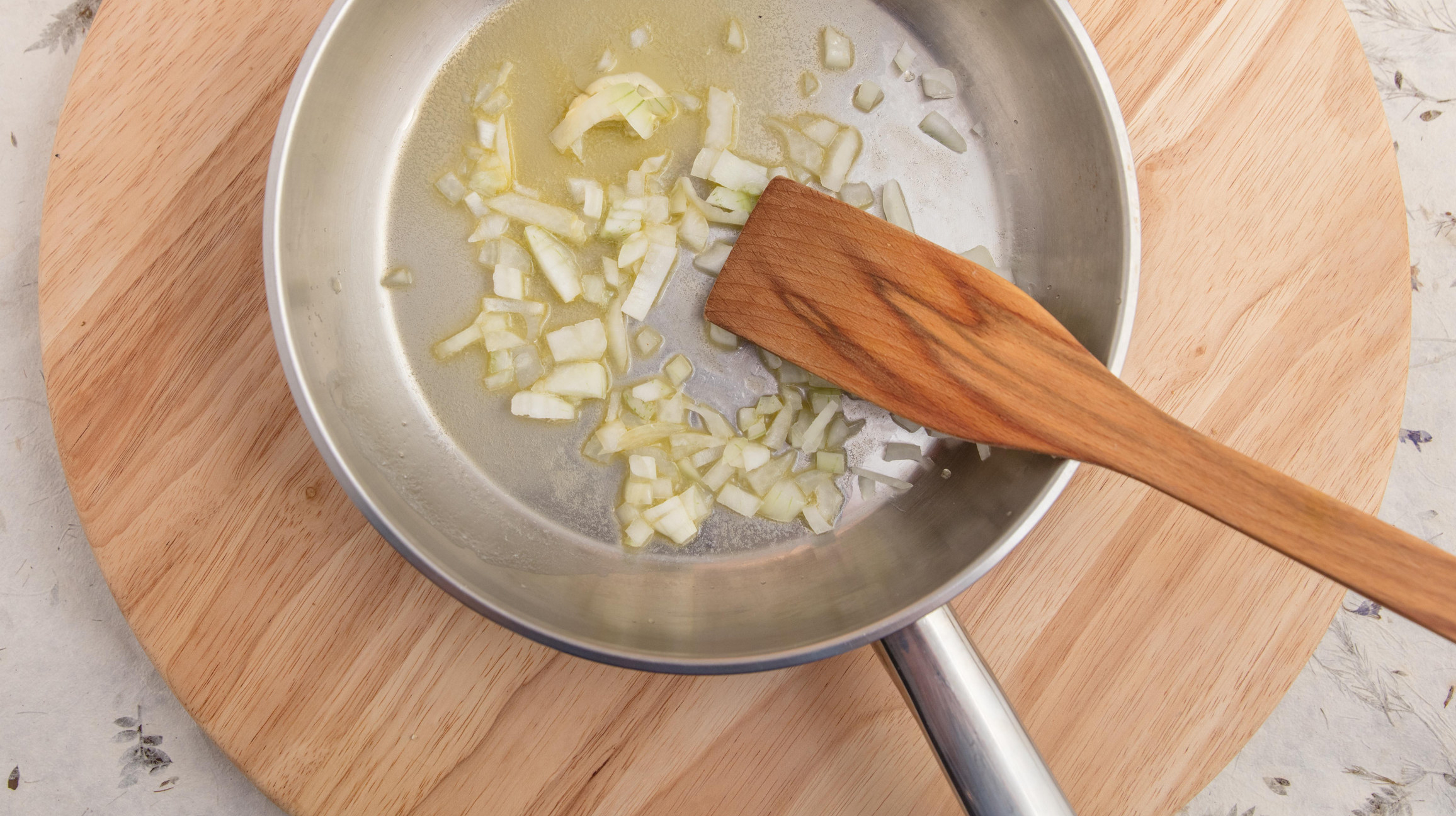 Frying chopped onion in butter.