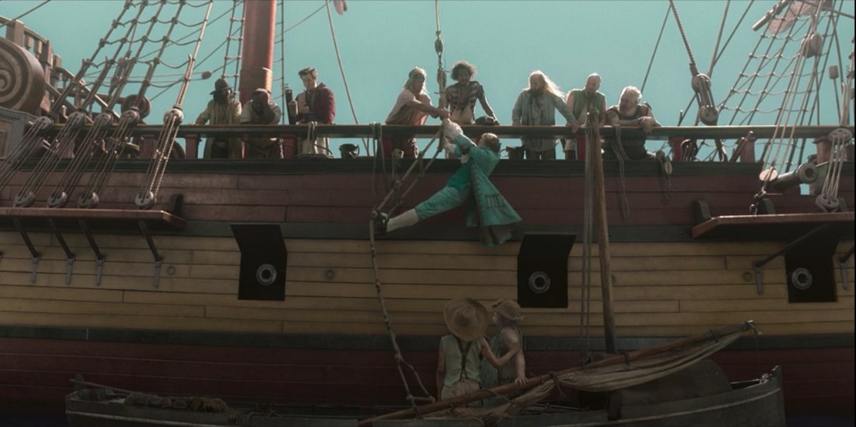 The side of a pirate ship. Stede is shown dangling from a rope ladder over a small fishing boat with two men in it, as Stede&#x27;s crew looks on from above.