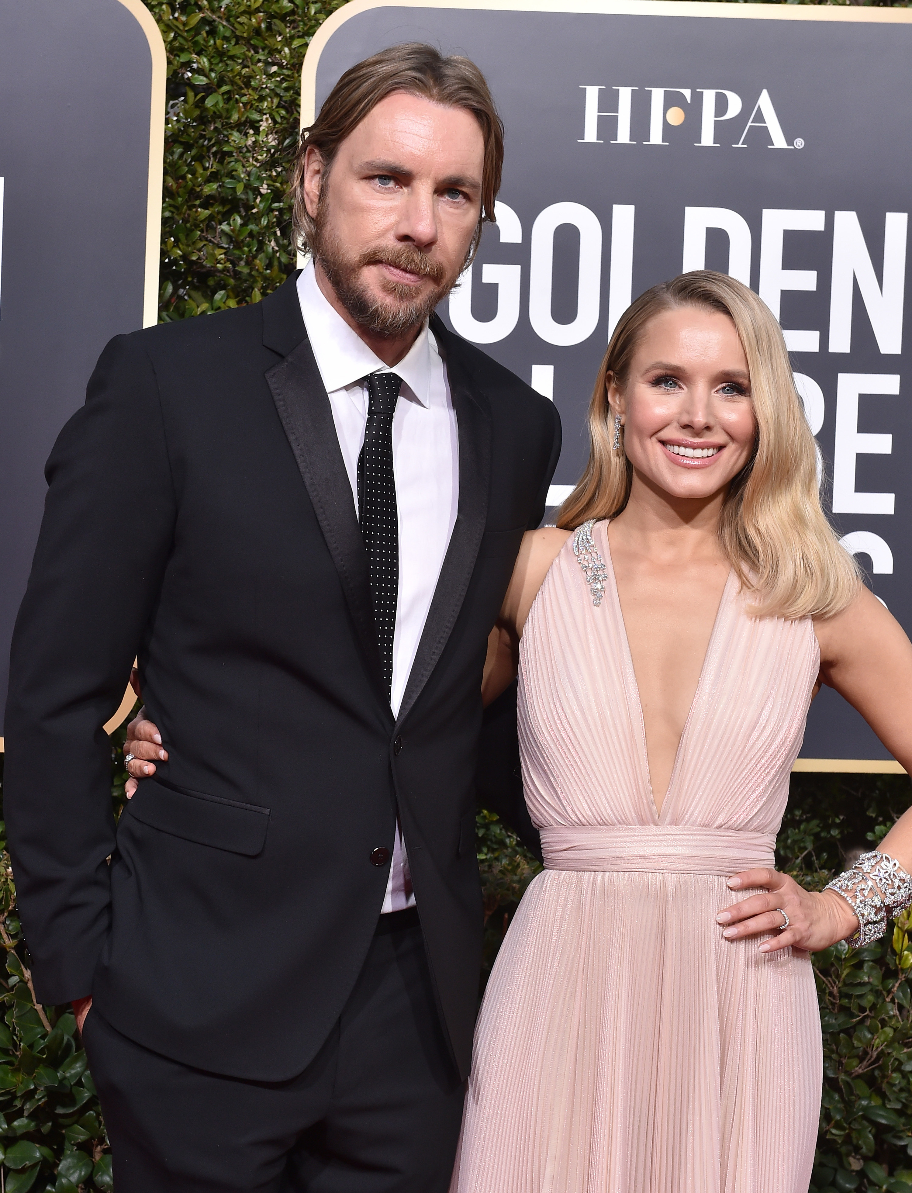 Dax Shepard and Kristen Bell with their arms around each other on the red carpet