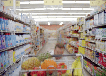 Justin Timberlake pushing a grocery cart