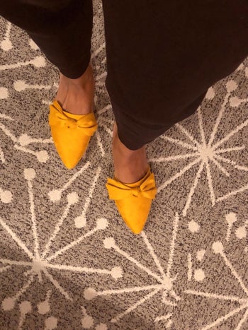 Reviewer wears same style mule with black wide leg pants