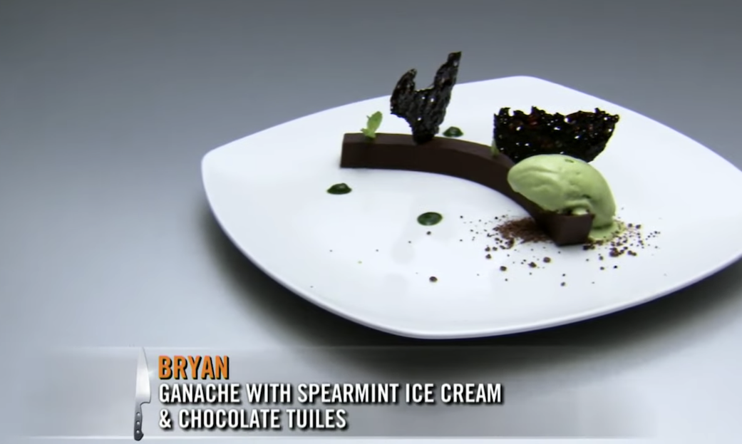 A plate of ganache with spearmint ice cream and chocolate tuiles.