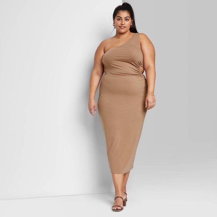 model wearing the tan dress