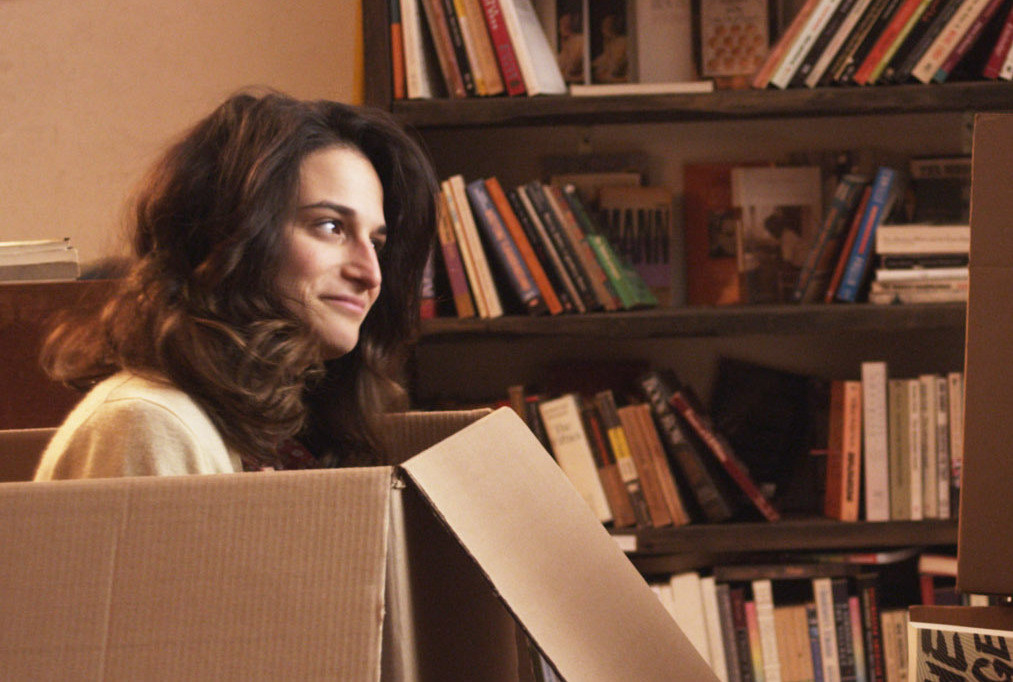 Jenny Slate sitting in a box in Obvious Child