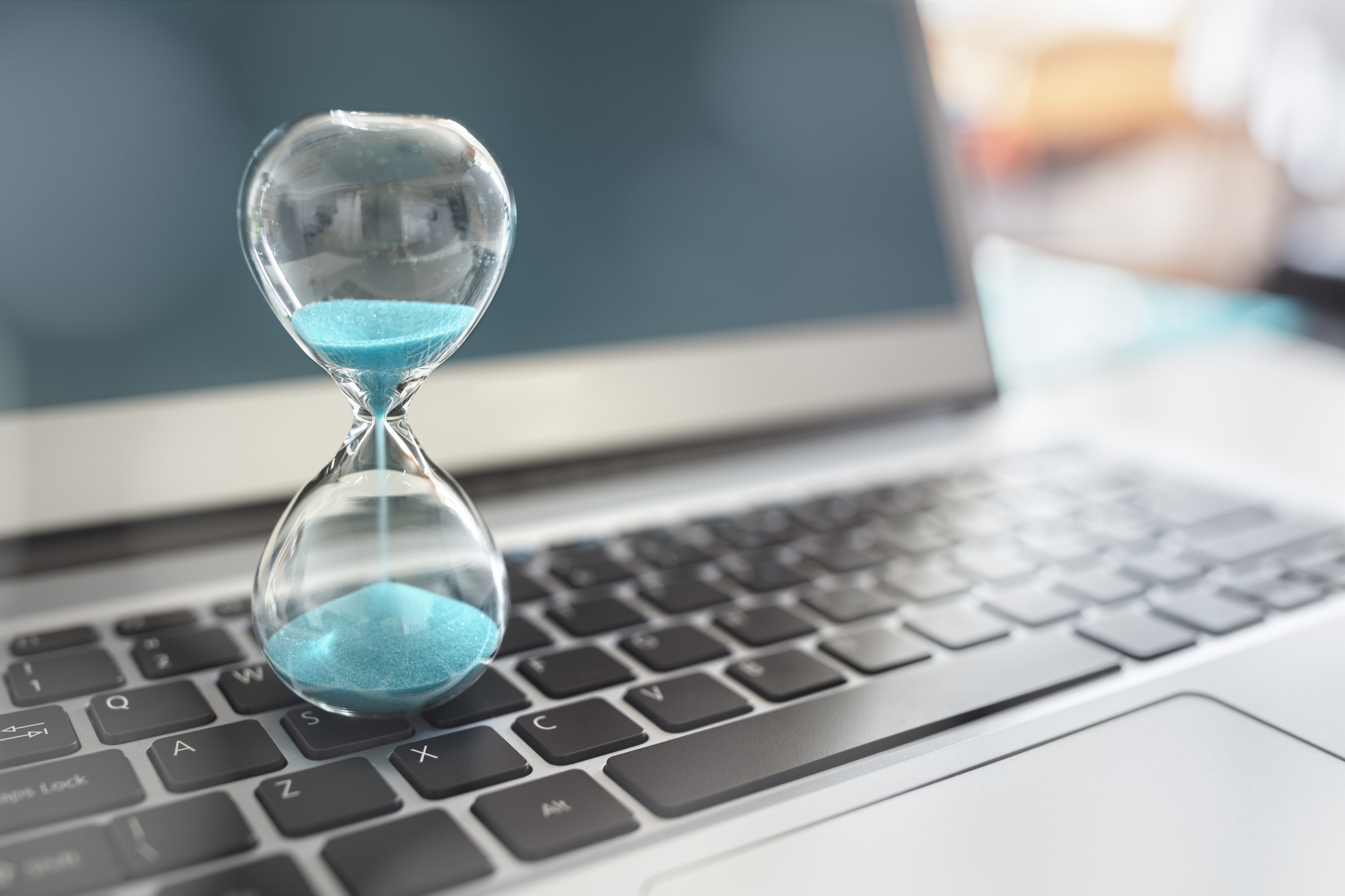 An hourglass on a keyboard