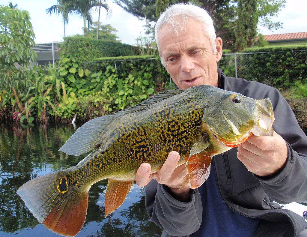 Jeremy Wade holding up a caught freshwater fish