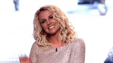 Britney Spears smiling and waving