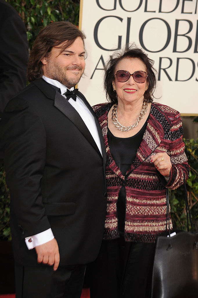 Jack Black wearing a suit and bowtie next to his mom, Judith Love Cohen
