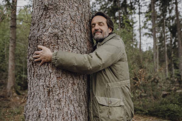 Man hugging a tree