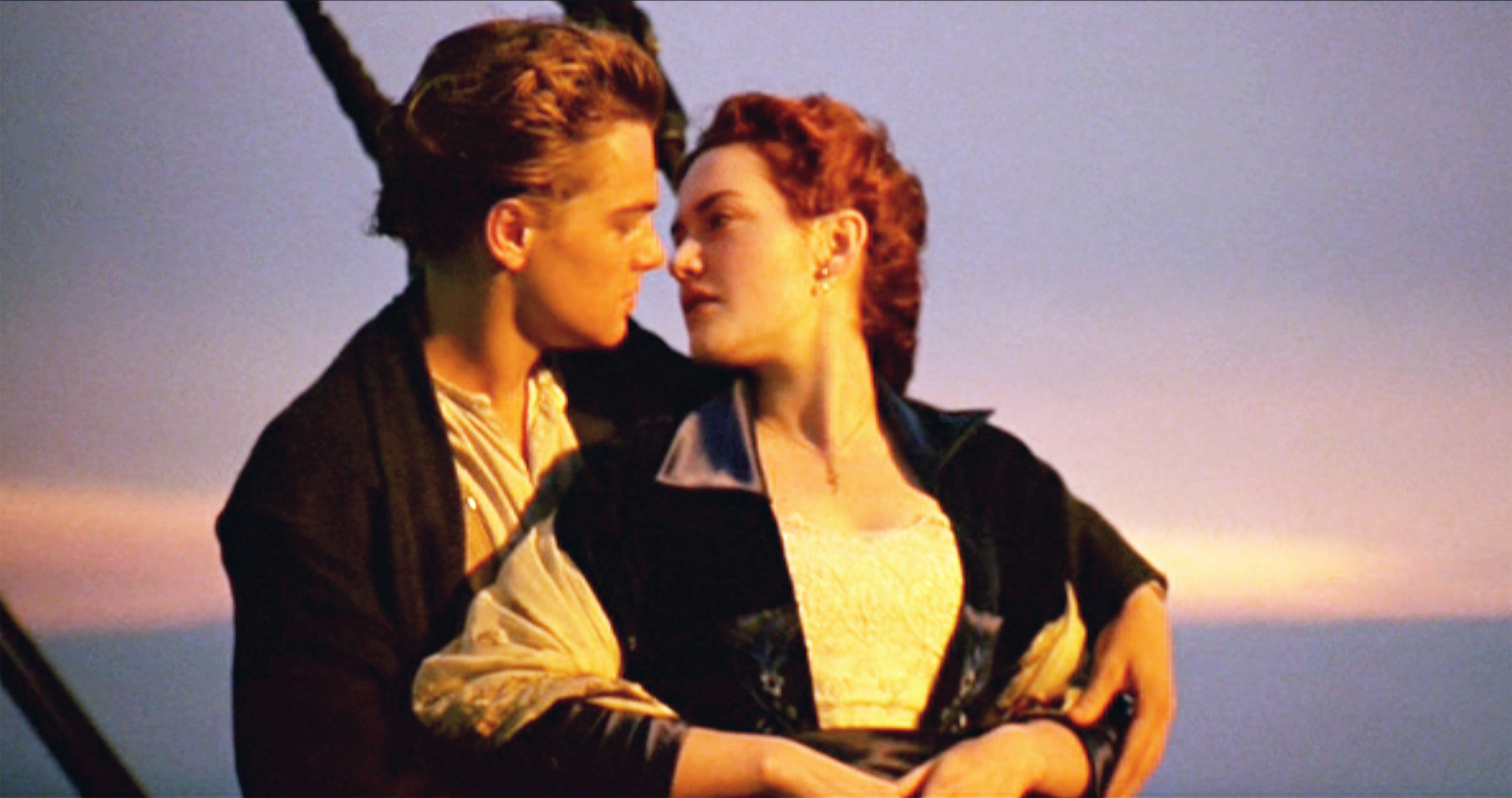 Leonardo DiCaprio as Jack and Kate Winslet as Rose stand at the front of the ship in &quot;Titanic&quot;
