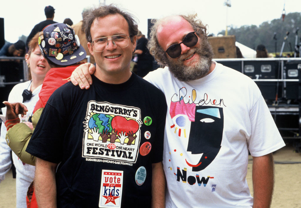 Ben and Jerry pose for a photo at a festival