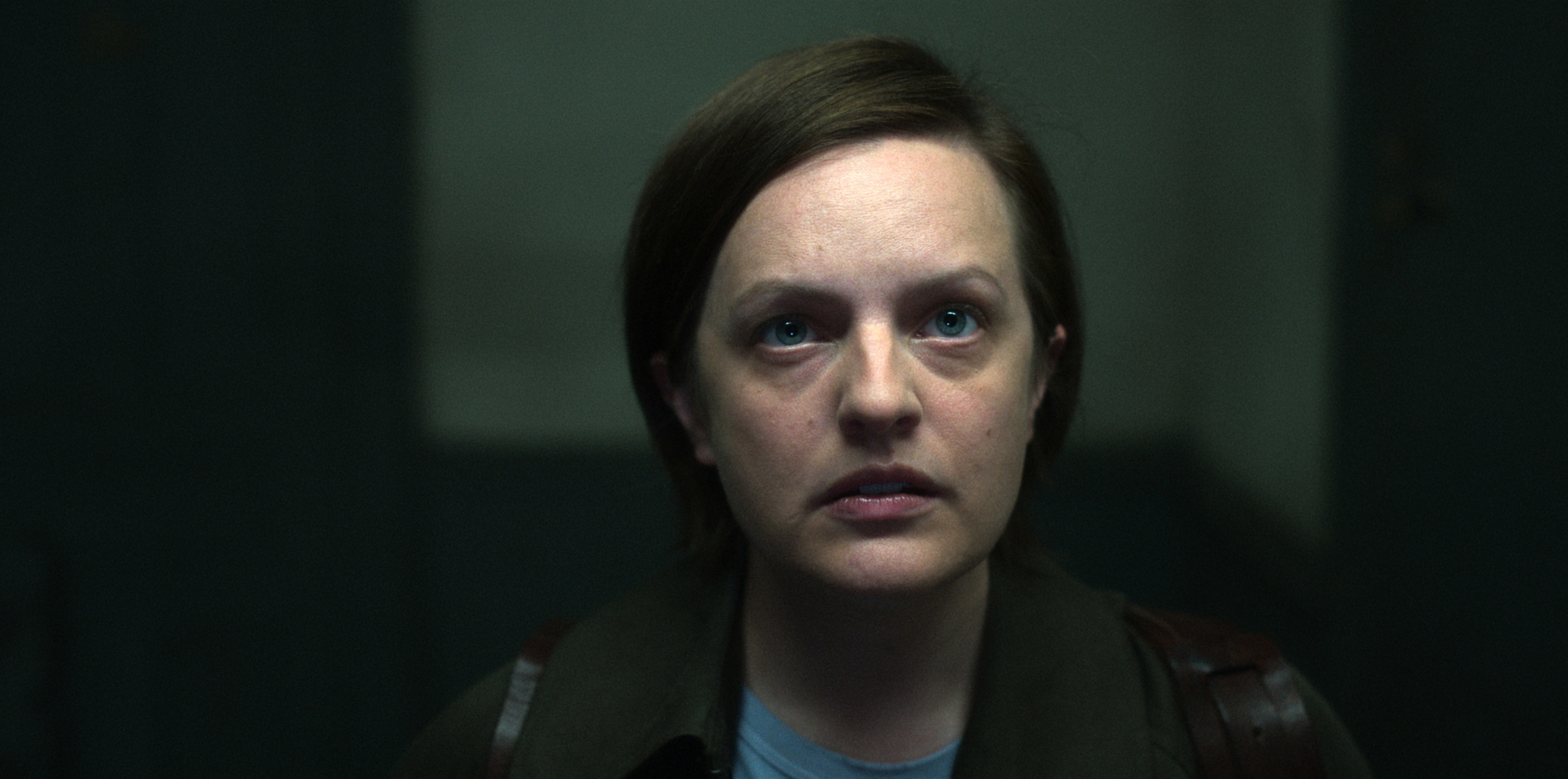 Elisabeth Moss looks at the camera