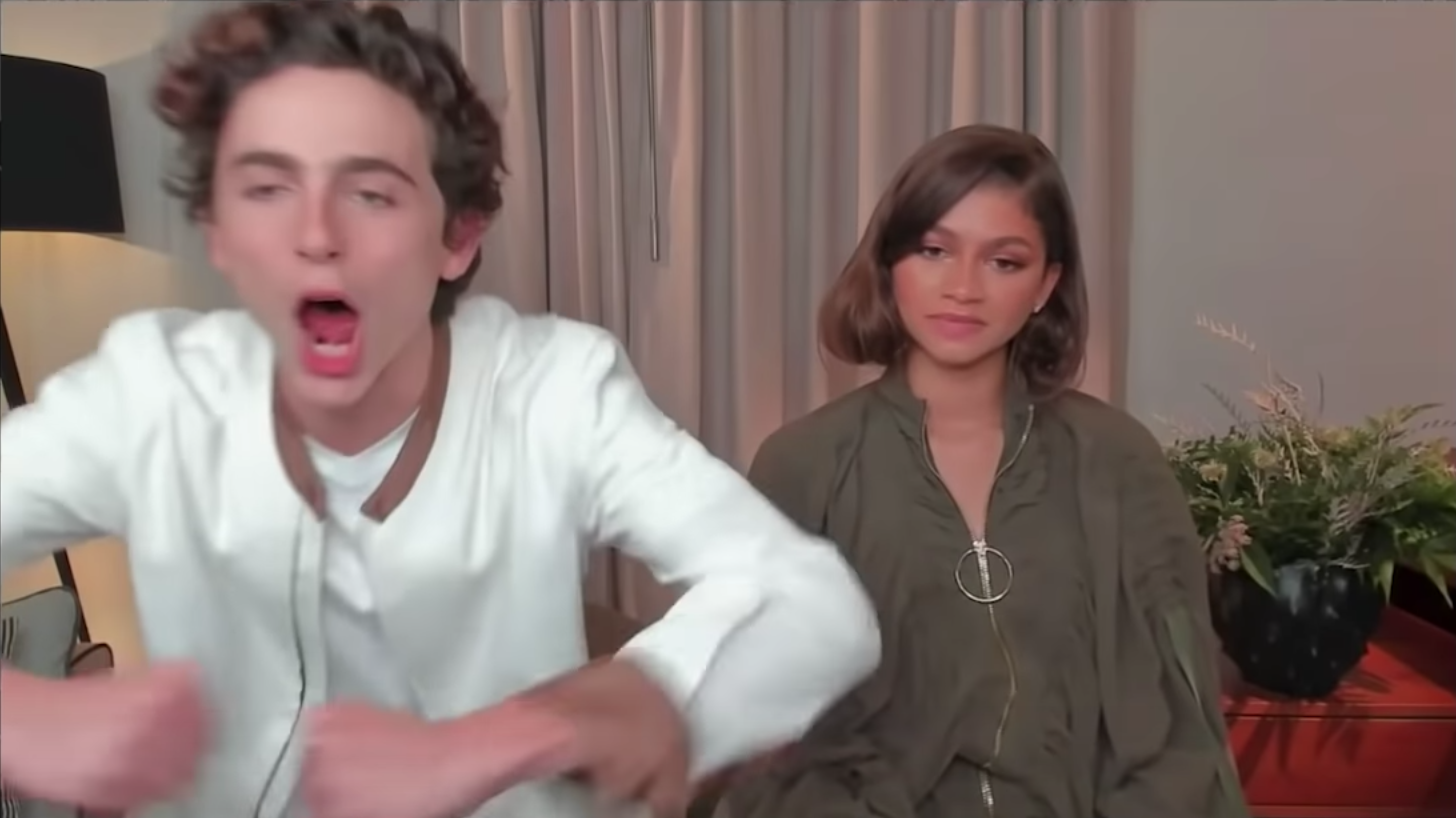 Zendaya looking super bored and confused while Timothée Chalamet looks pumped