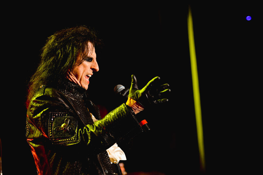 Alice Cooper performing onstage.