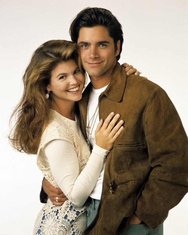 Lori Loughlin as Becky and John Stamos as Jesse pose for a &quot;Full House&quot; Season 7 promotional photo in August 1993