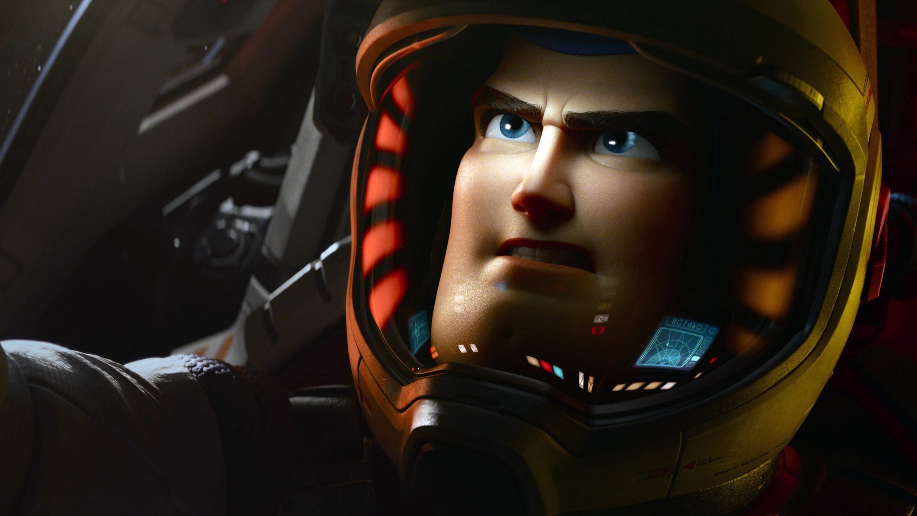 A close up of Buzz Lightyear as he drives a spaceship