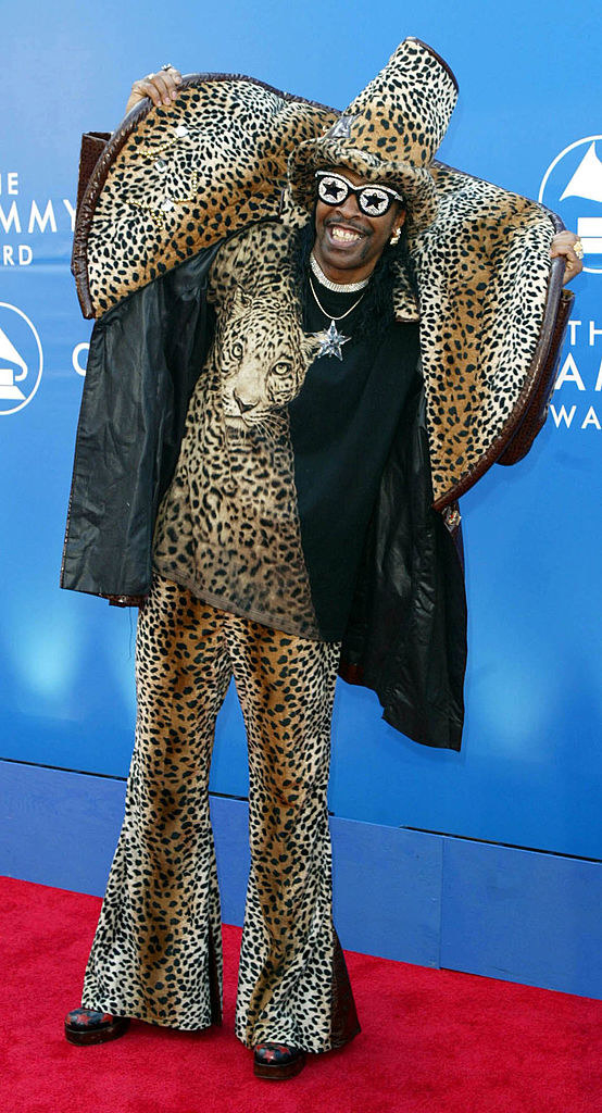 Wearing a leopard-print jacket with wide collar and matching flared pants and matching hat
