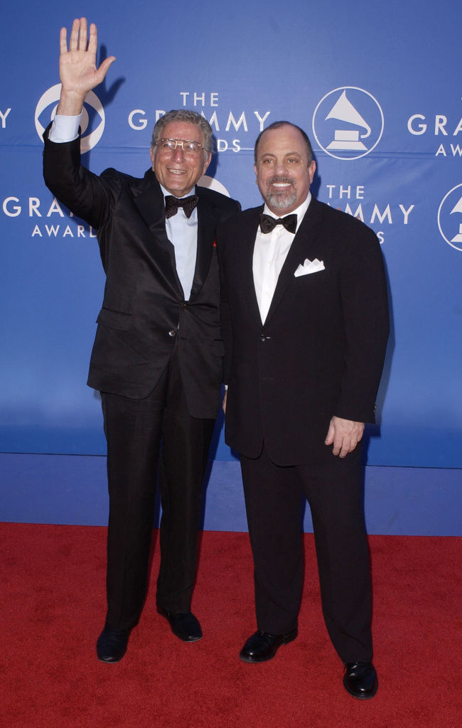 Tony waving, and both men wearing bow ties