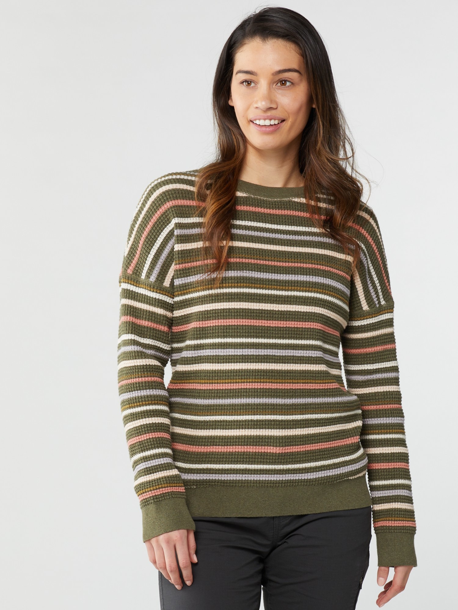 Model wearing the green striped long-sleeve sweater