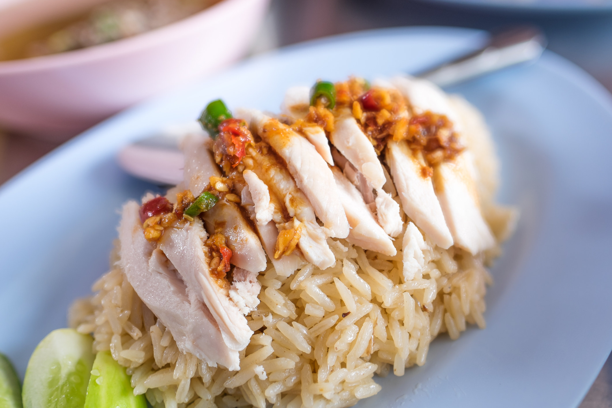 Hainanese chicken rice with a spicy condiment on top