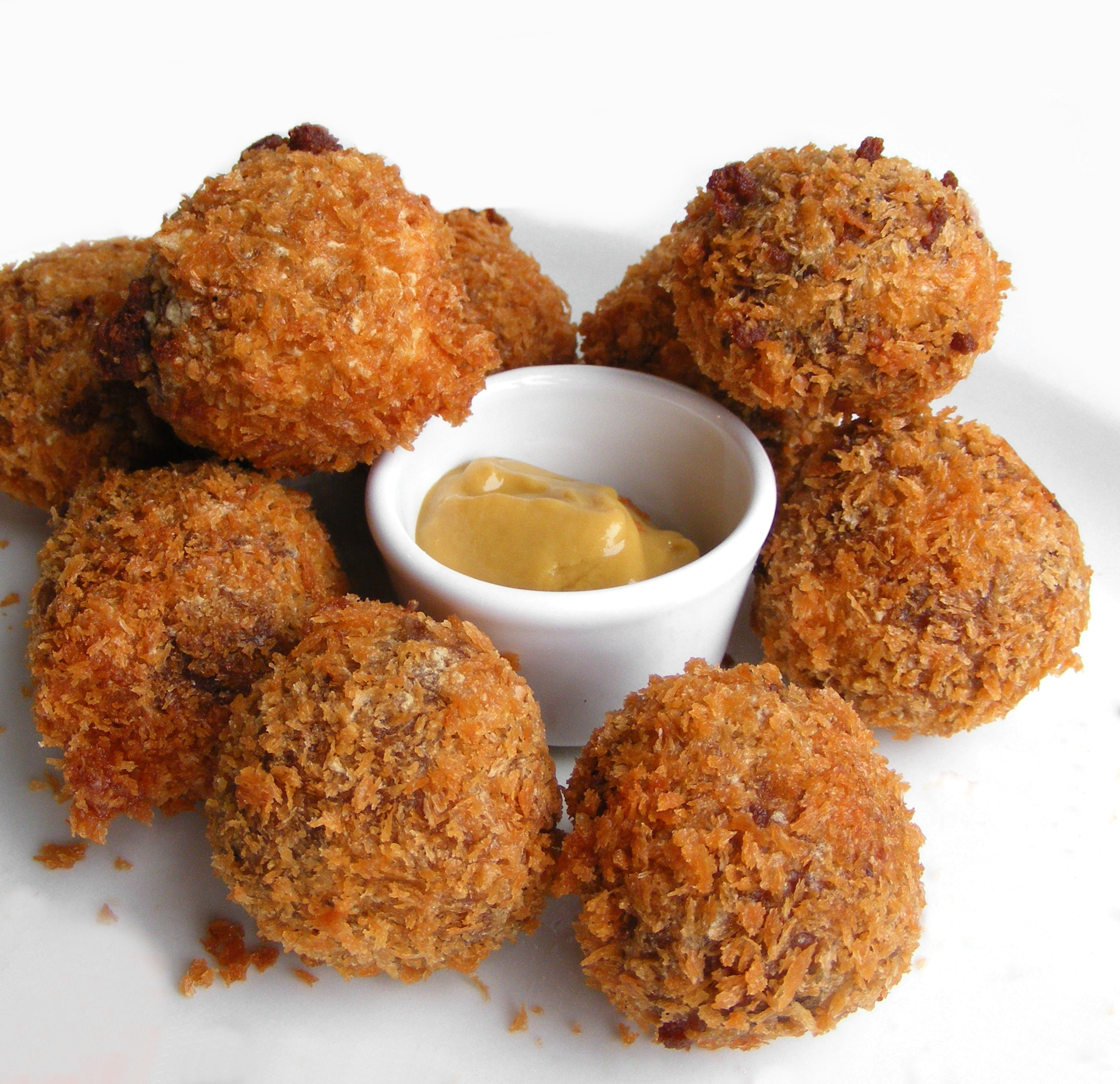 A famous Dutch fried snack called bitterballen, served with mustard