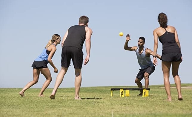A group of people playing the game in a field