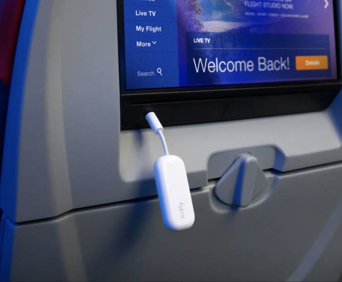 The device plugged into an airplane&#x27;s seat screen