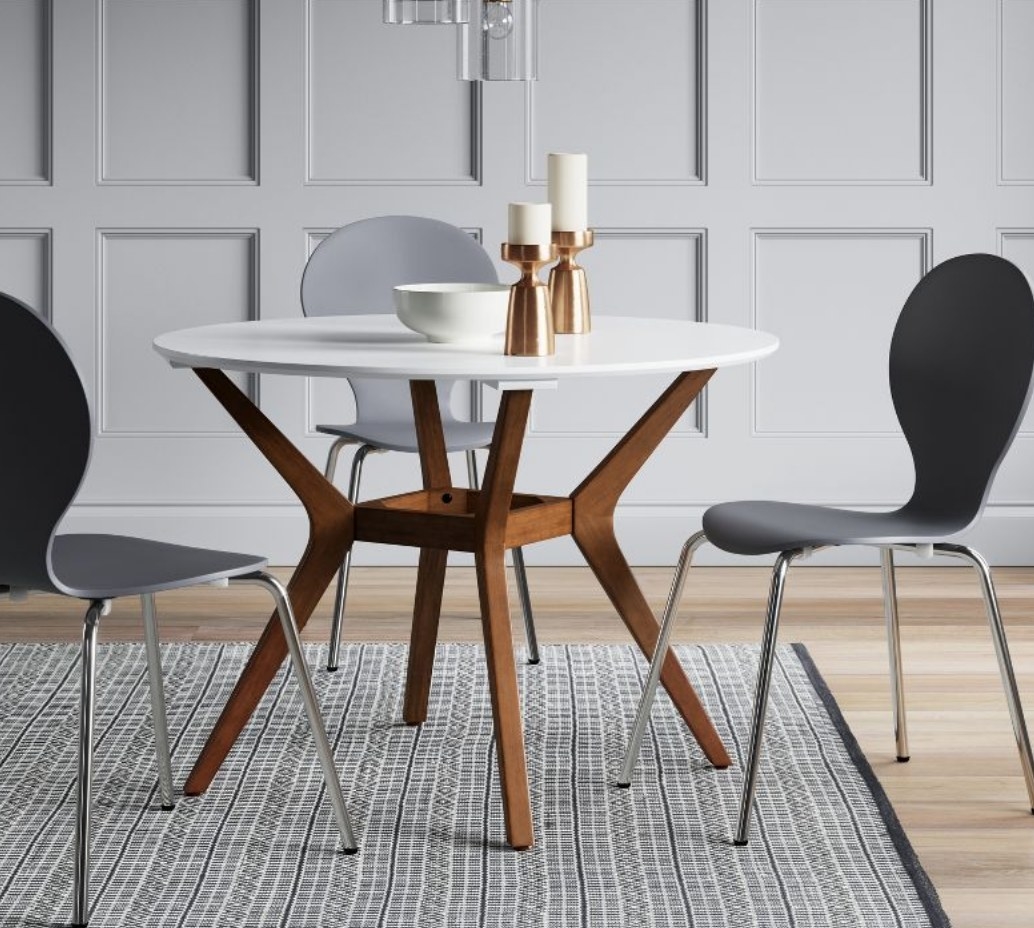 A wooden/white round dining table