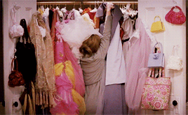 Jane from 27 dresses trying to hang up a dress in her stuffed bridesmaid dress closet