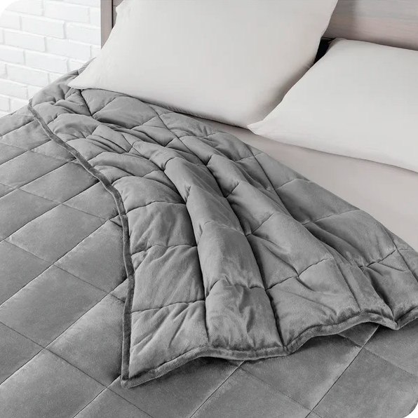 Gray cotton blanket on a bed