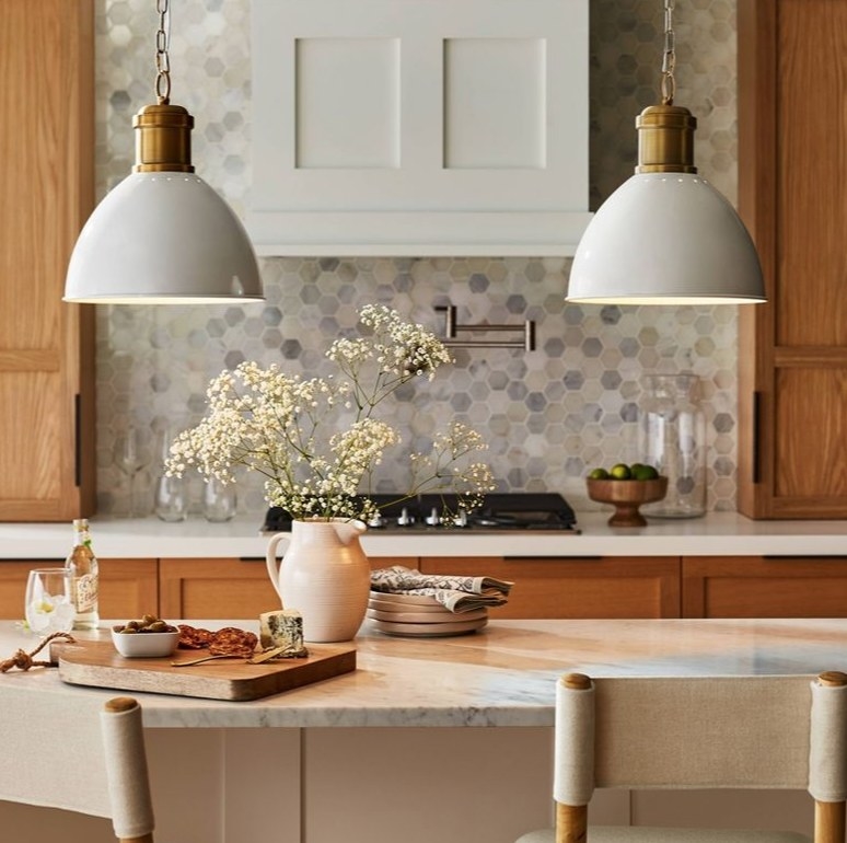 White dome and gold pendant lamps in a kitchen