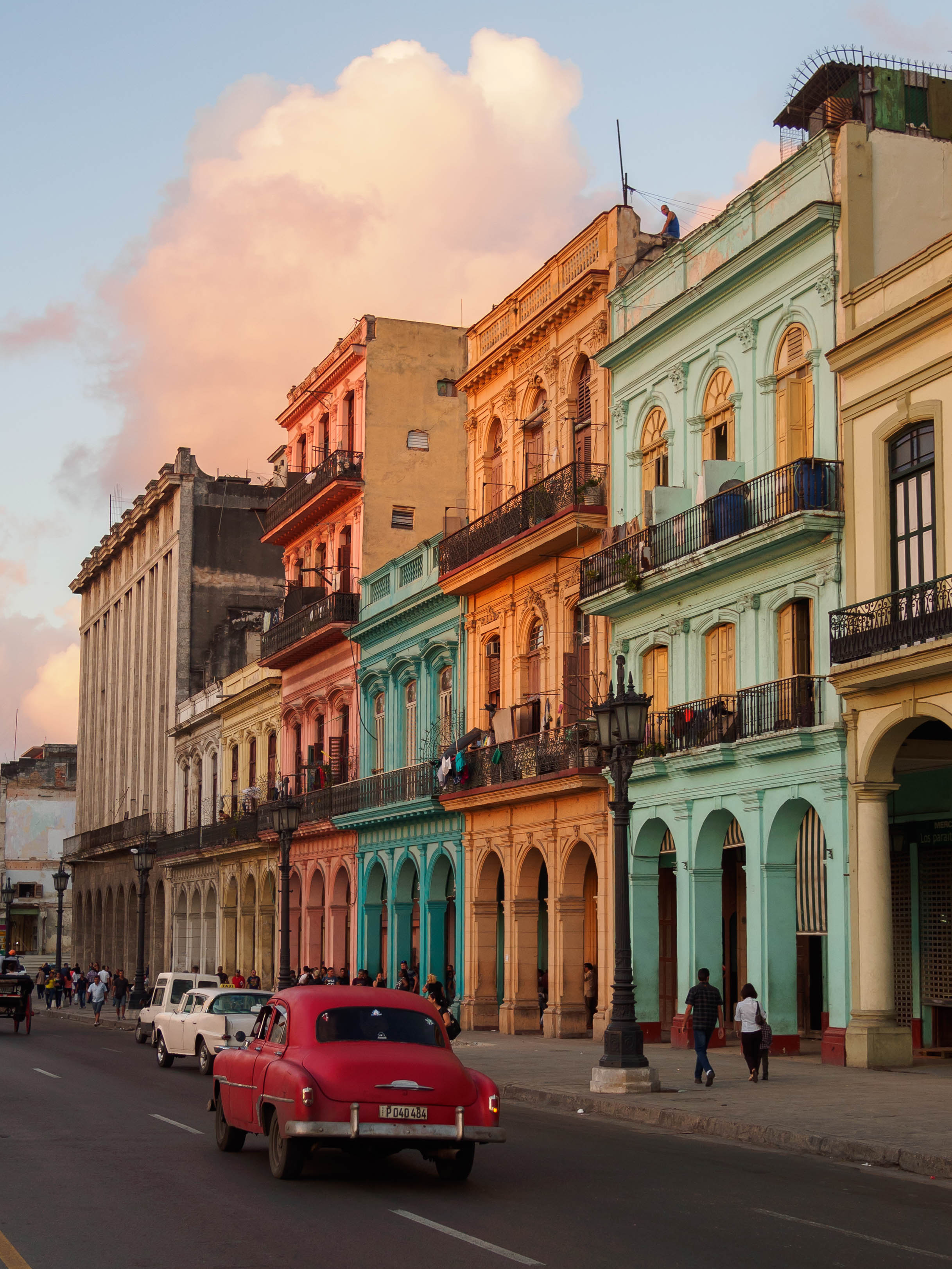 Colorful buildings and vintage cars in Havana, Cuba