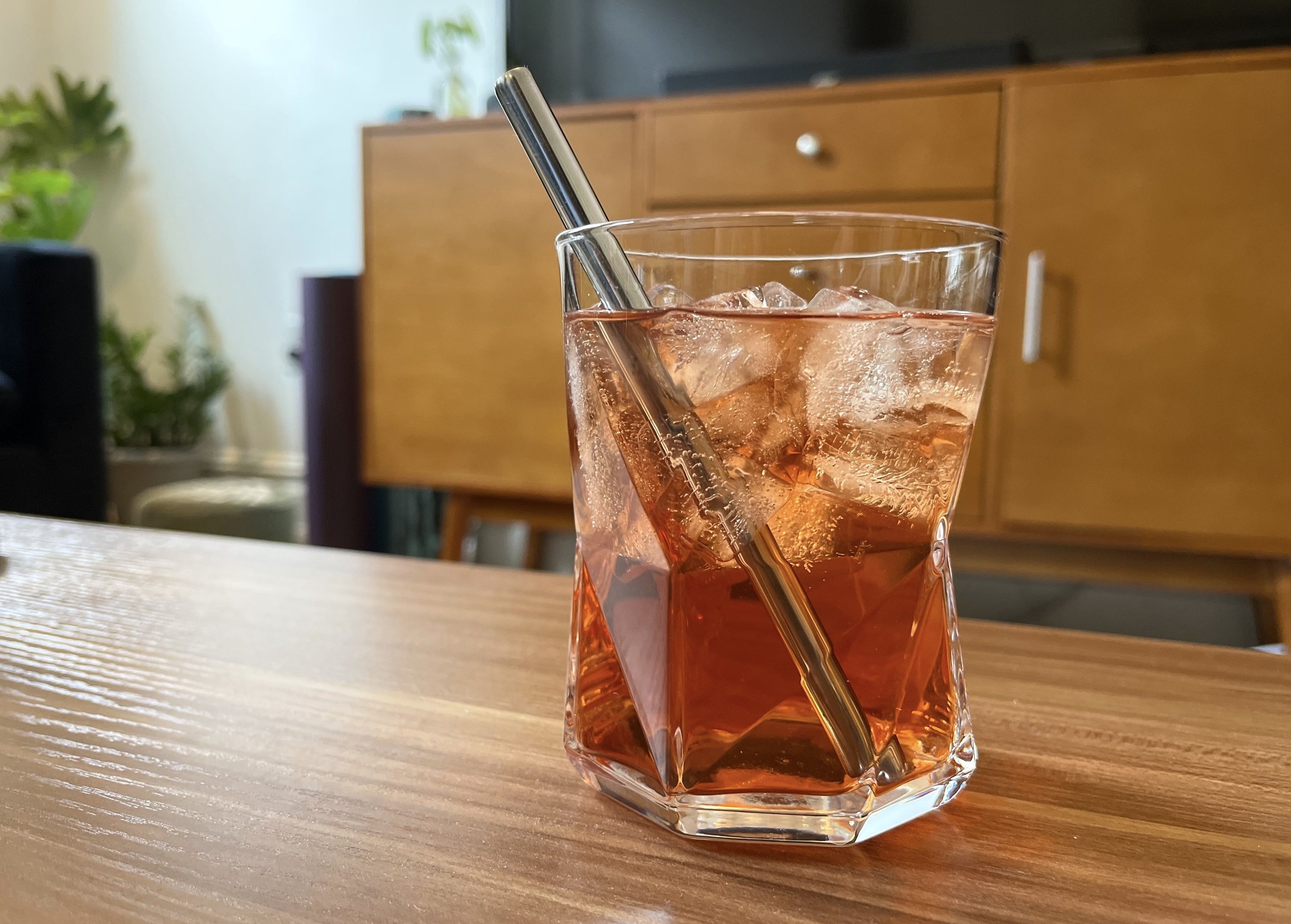 drink with a small metal straw