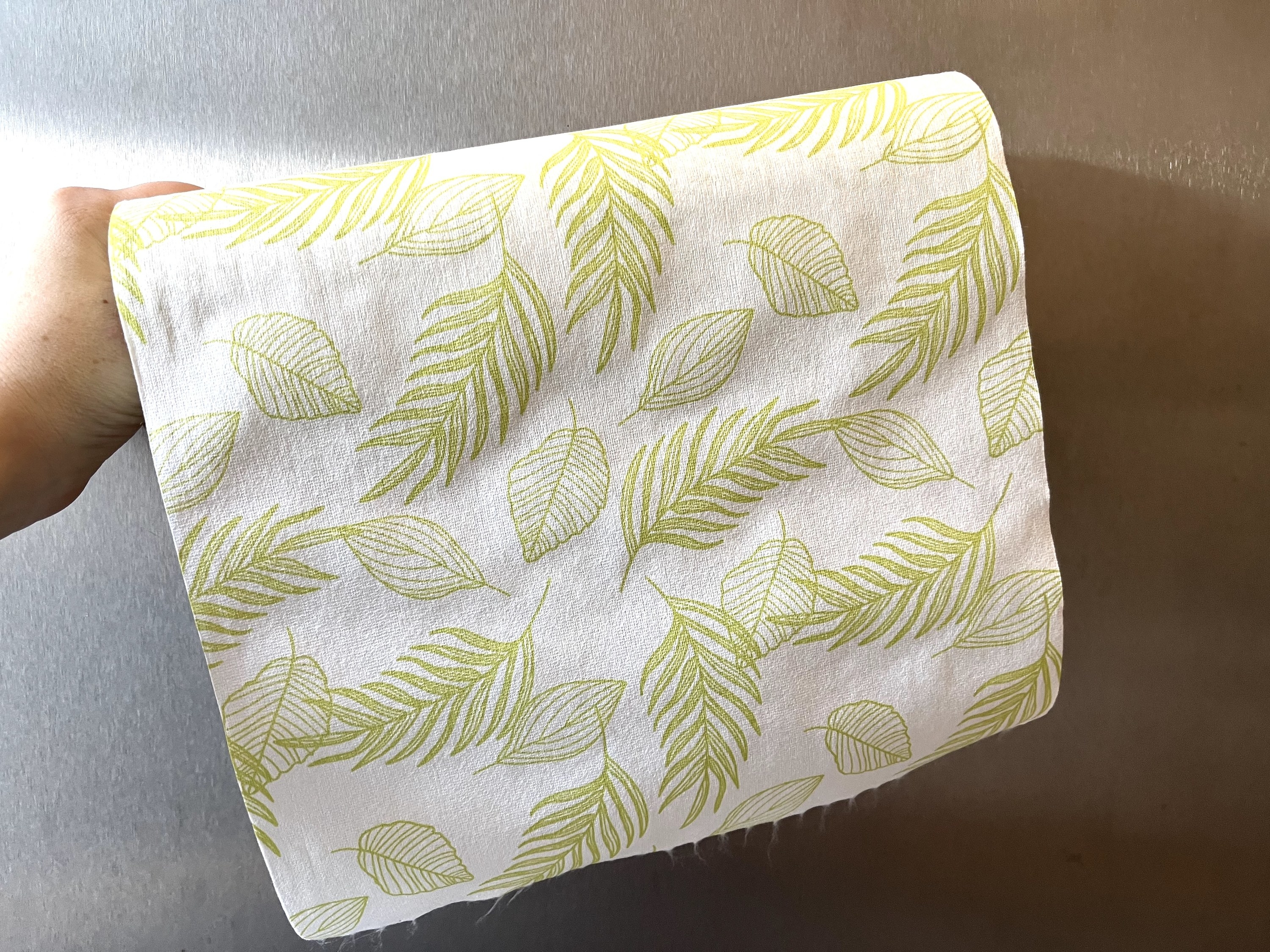 a cloth paper towel with a leaf print